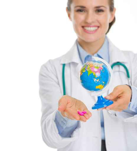 Travel doctor with pink pill and small globe